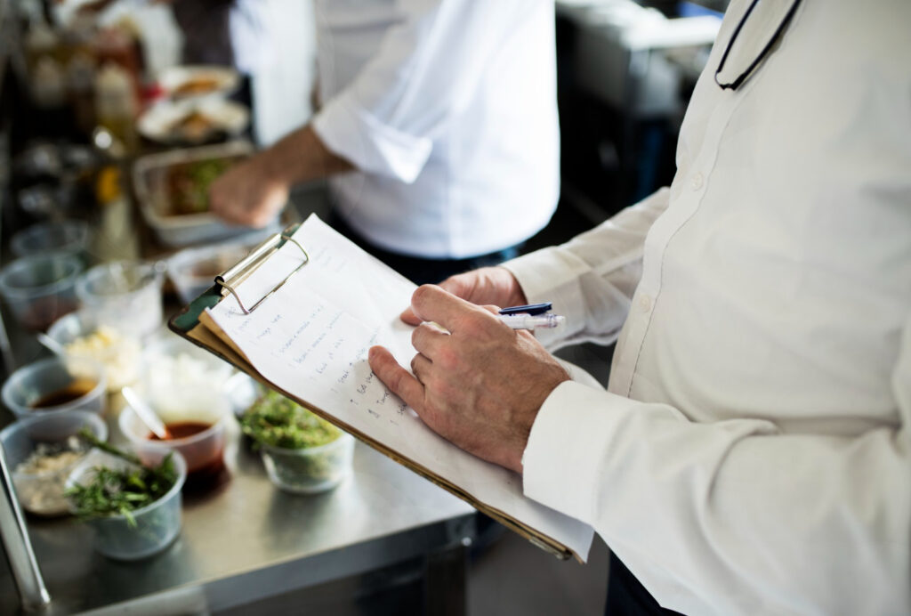 US Health Department inspector checking food safety compliance for business permits